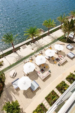 a bedroom with a bed dresser and a window