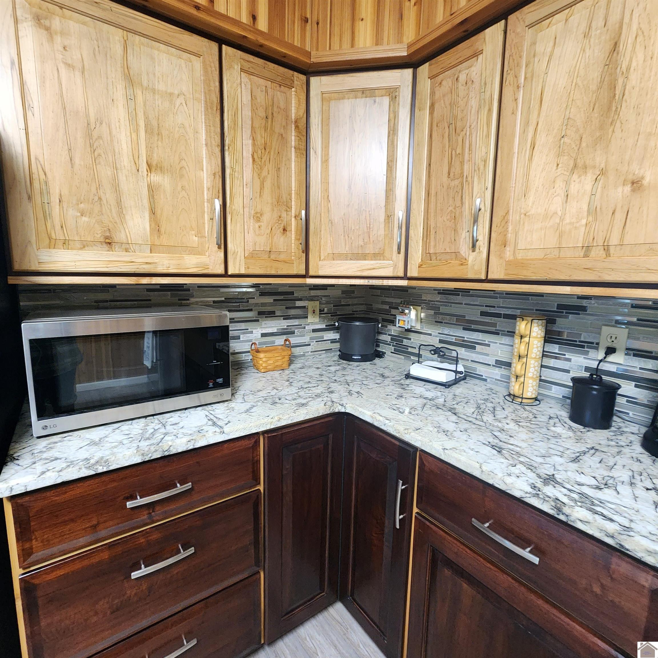 37 Lands End Road Cadiz, KY 42211 - Photo 7 of 23 Crafted to Perfection: Love the Burley Maple solid wood top cabinets. The Base cabinets are done in a beautiful solid cherry wood. With a matching rolling island done in the burley maple wood. Paired with the granite tops. Handmade Custom cabinets