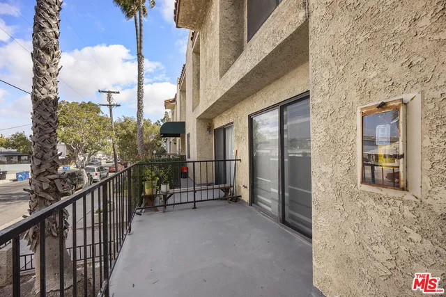 a view of balcony with furniture