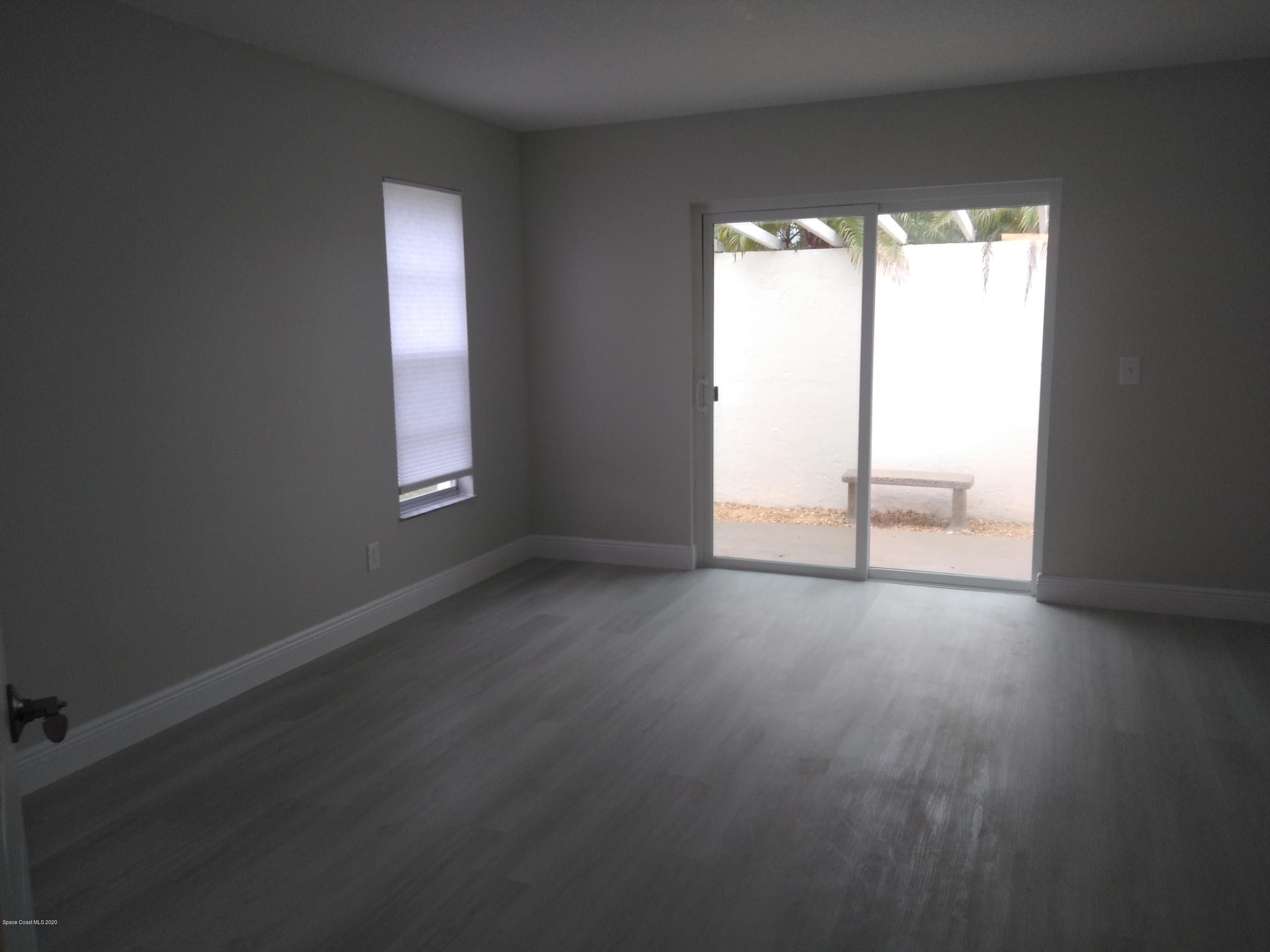 770 Montclair Road Northeast, Unit 1 Palm Bay, FL 32905 - Photo 14 of 23 an empty room with a window