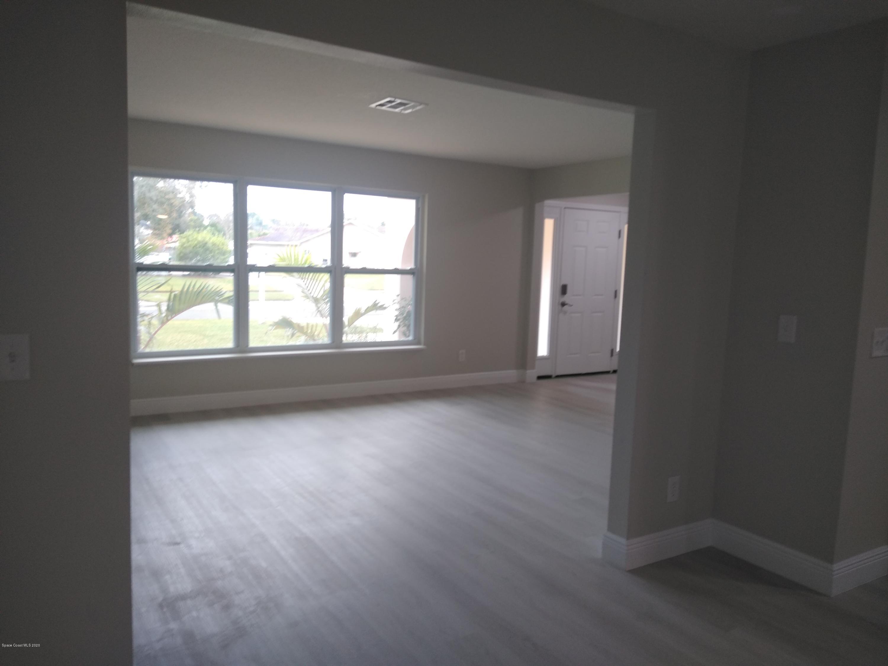 770 Montclair Road Northeast, Unit 1 Palm Bay, FL 32905 - Photo 16 of 23 an empty room with a window