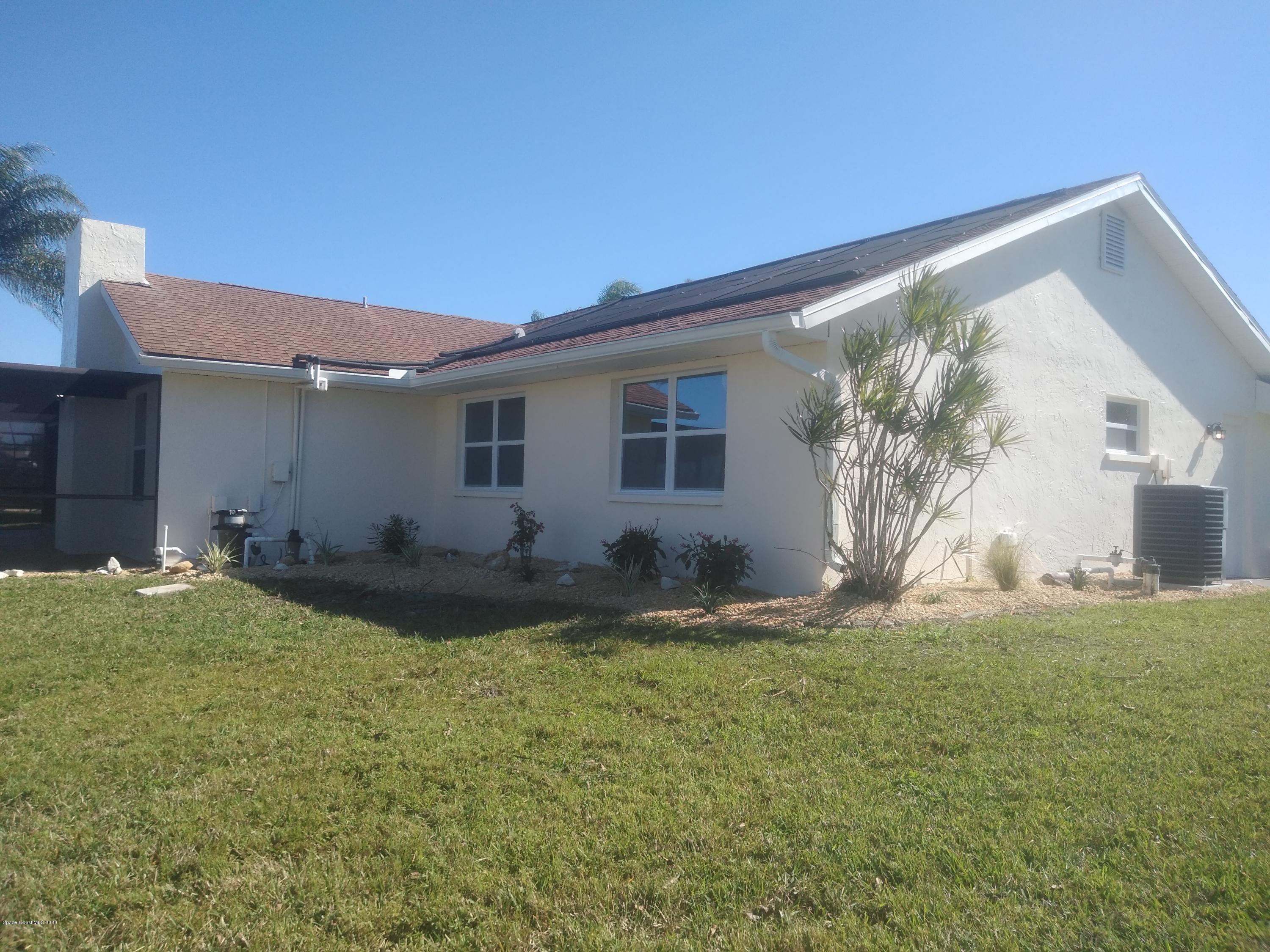770 Montclair Road Northeast, Unit 1 Palm Bay, FL 32905 - Photo 7 of 23 a view of back yard of the house