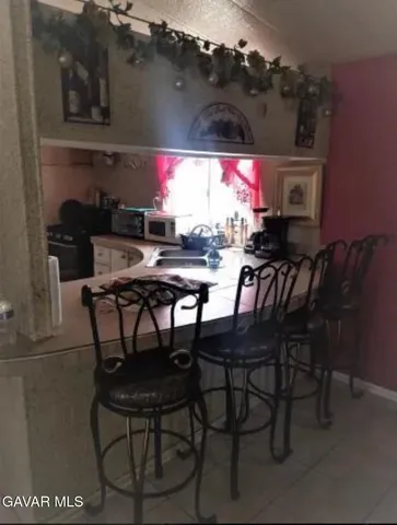 a view of a dining table and chairs in the patio