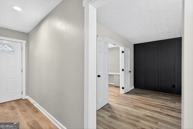 a view of livingroom with hardwood floor and hallway