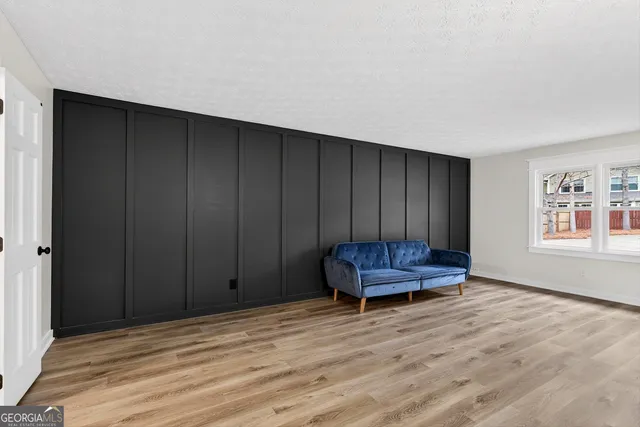 a living room with a couch and a window