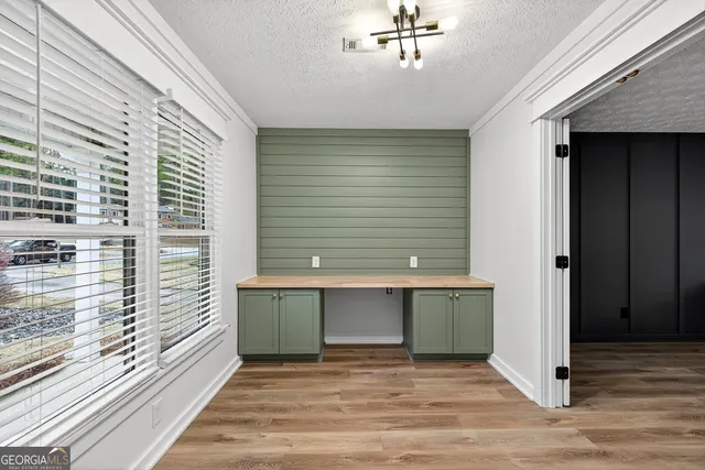 wooden floor with white walls