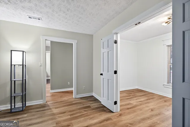 a view of small space with wooden floor