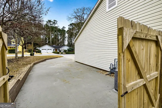 a view of yard with swimming pool and sitting area