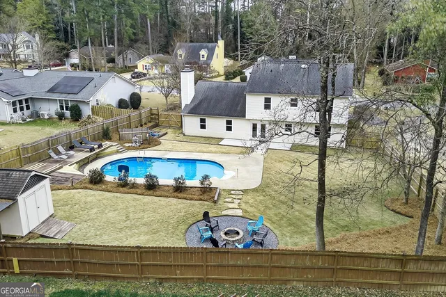 a view of a lake with couches chairs