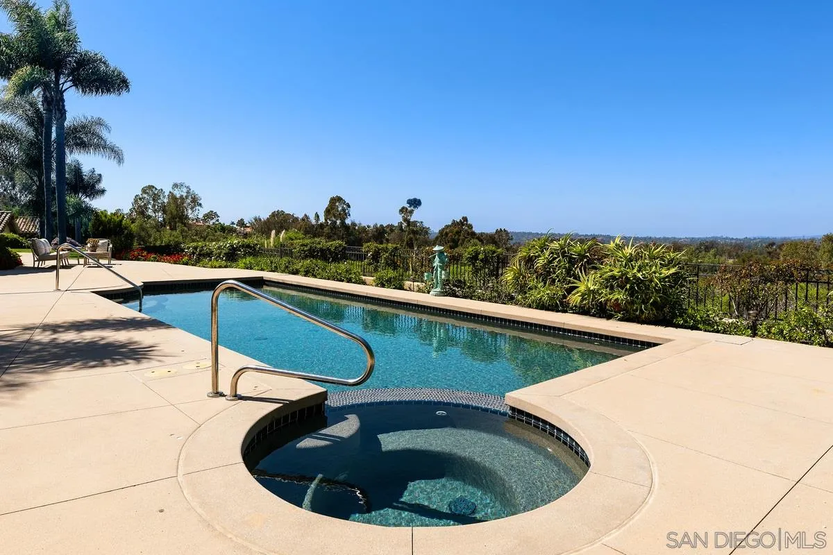 a view of a swimming pool with a chairs