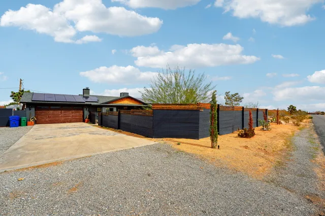 a view of a house with snow on the roof