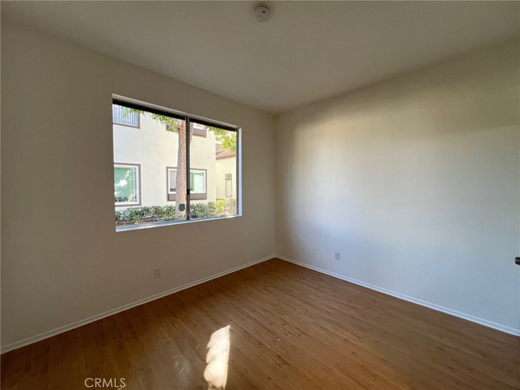 16 Key West Laguna Niguel, CA 92677 - Photo 11 of 23 an empty room with wooden floor and windows