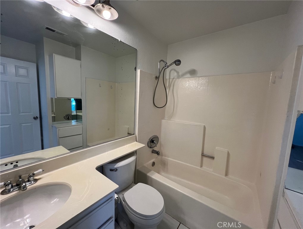 16 Key West Laguna Niguel, CA 92677 - Photo 12 of 23 a bathroom with a sink a toilet and a bathtub