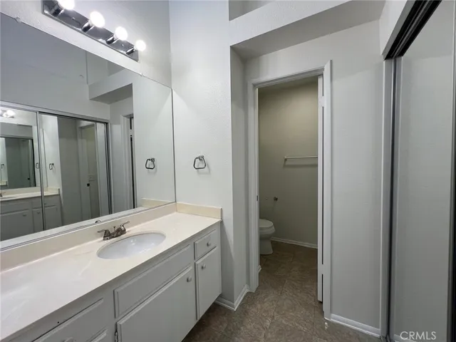 a bathroom with a glass shower door