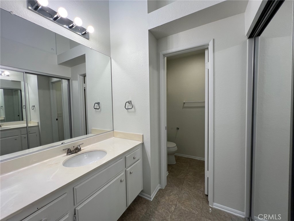 16 Key West Laguna Niguel, CA 92677 - Photo 15 of 23 a bathroom with a double vanity sink and mirror with shower