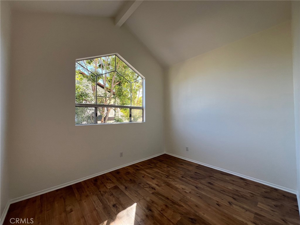 16 Key West Laguna Niguel, CA 92677 - Photo 17 of 23 an empty room with wooden floor and windows
