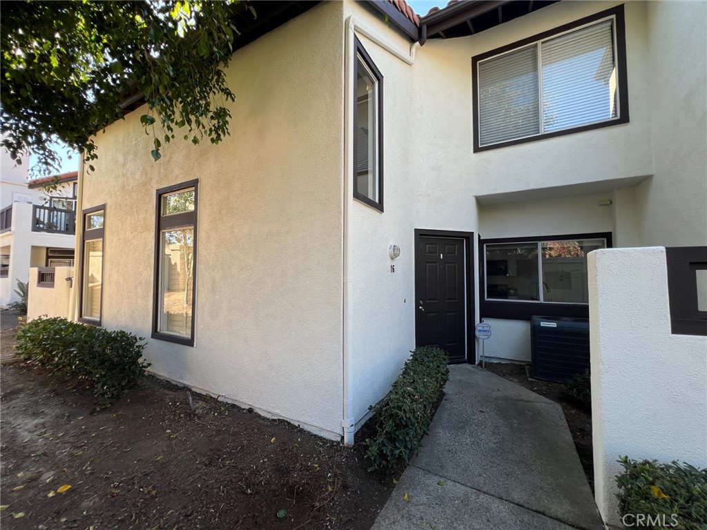 16 Key West Laguna Niguel, CA 92677 - Photo 20 of 23 a front view of a house with a yard