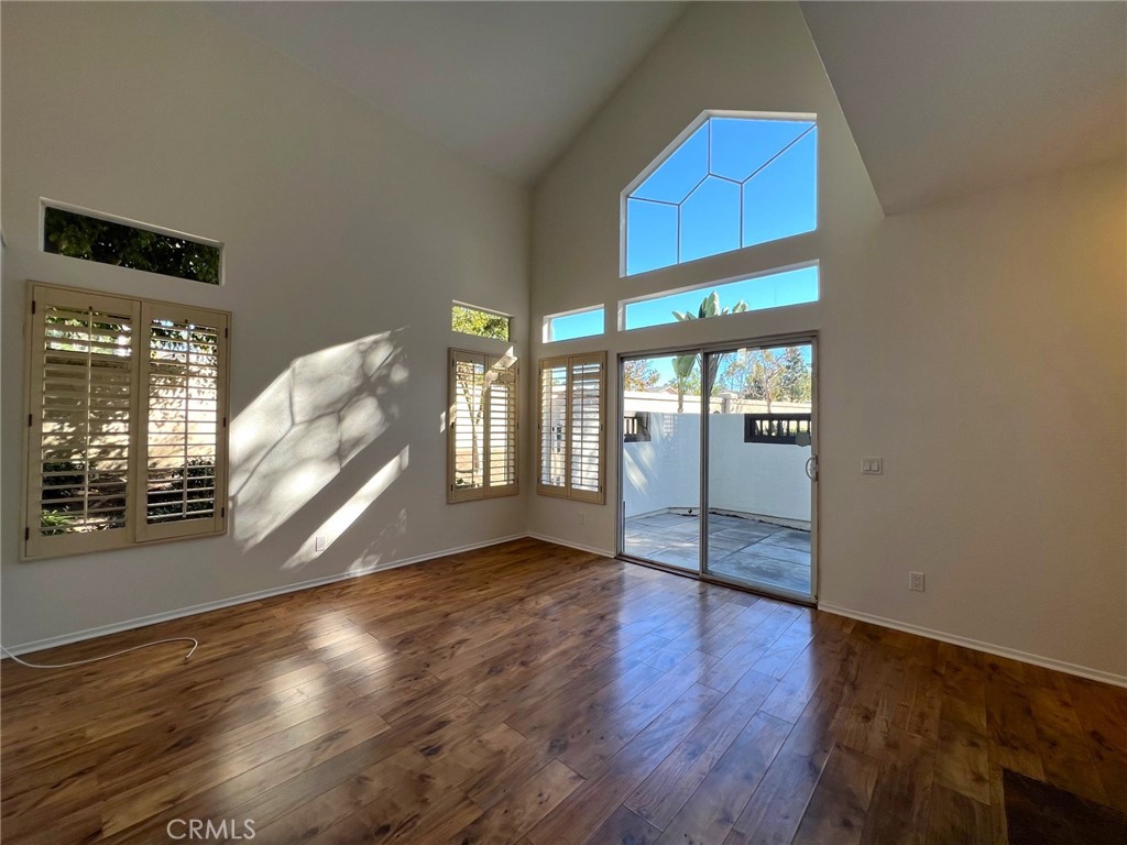 16 Key West Laguna Niguel, CA 92677 - Photo 5 of 23 a view of an empty room with wooden floor and a window