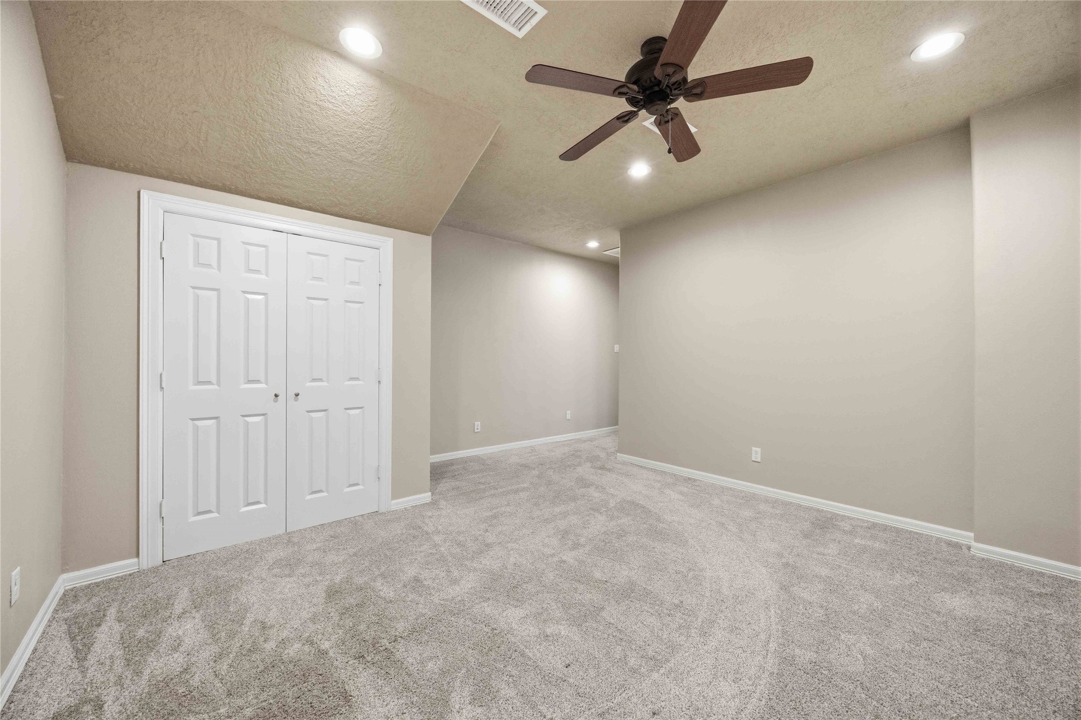 1930 Old River Road Montgomery, TX 77356 - Photo 29 of 49 Bedroom 2 is carpeted and provides quite a bit of space. Double doors open to the closet.