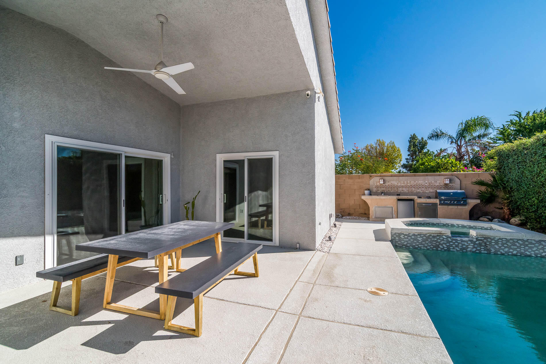67685 Garbino Road Cathedral City, CA 92234 - Photo 12 of 45 a view of a house with backyard sitting area and garden