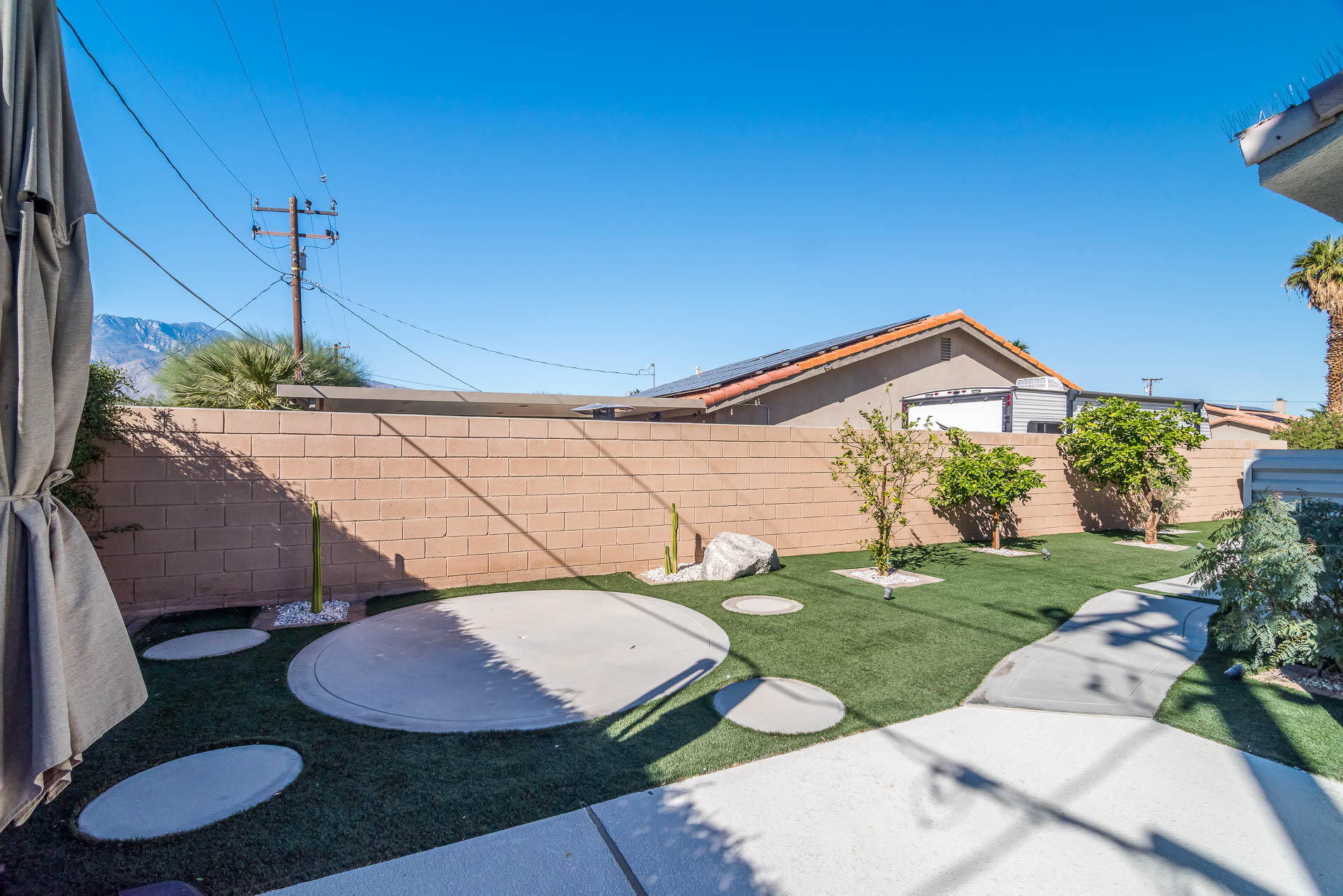 67685 Garbino Road Cathedral City, CA 92234 - Photo 13 of 45 a backyard of a house with table and chairs