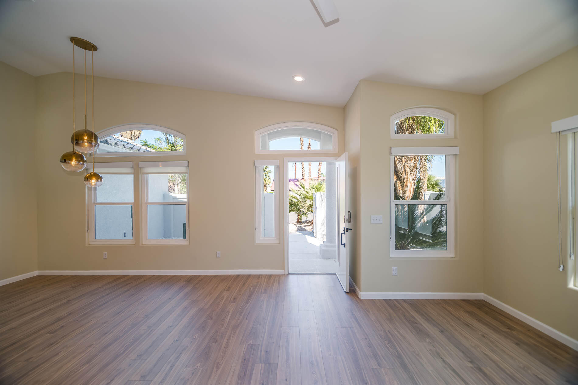 67685 Garbino Road Cathedral City, CA 92234 - Photo 15 of 45 a view of an entryway with wooden floor and a window