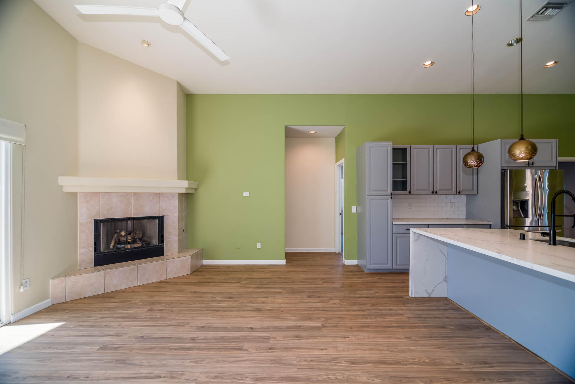 67685 Garbino Road Cathedral City, CA 92234 - Photo 24 of 45 a view of a kitchen with a sink a fireplace and a window
