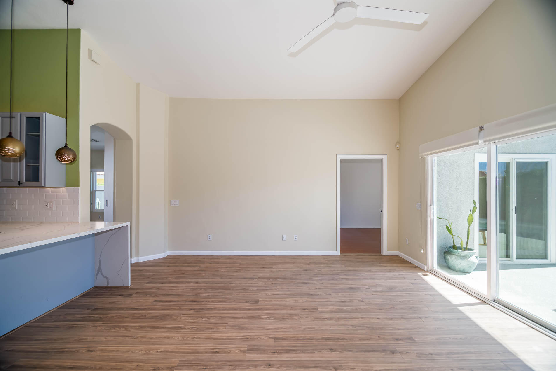 67685 Garbino Road Cathedral City, CA 92234 - Photo 25 of 45 a view of empty room with wooden floor and fan