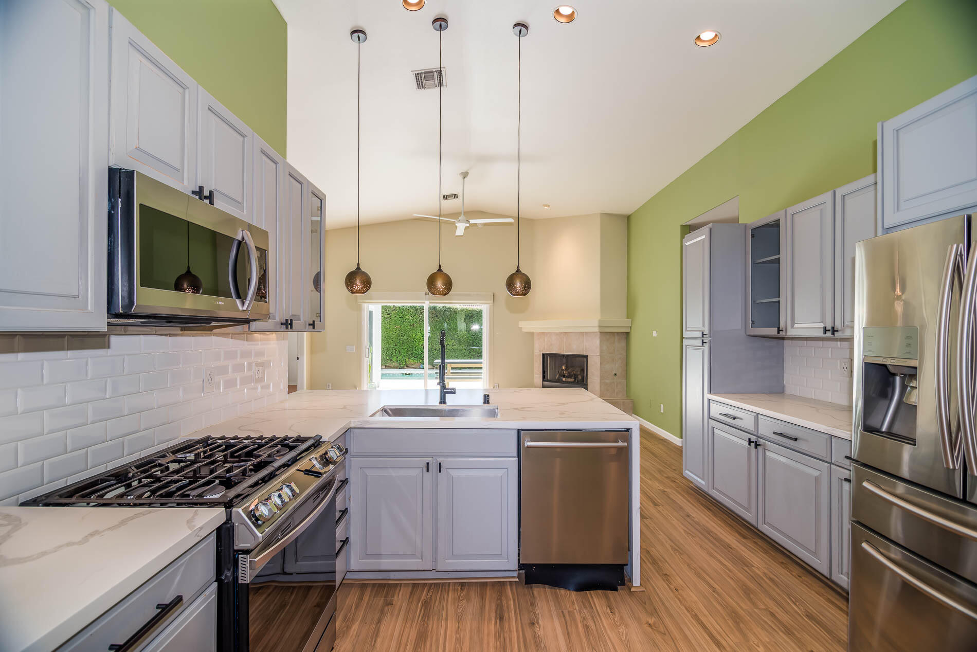 67685 Garbino Road Cathedral City, CA 92234 - Photo 29 of 45 a kitchen with a sink stove and refrigerator