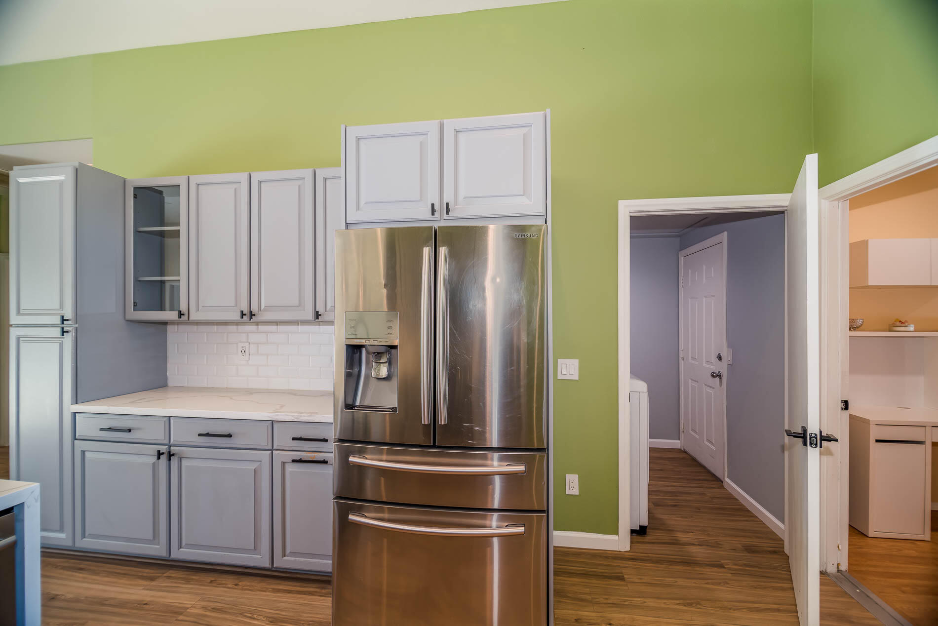67685 Garbino Road Cathedral City, CA 92234 - Photo 30 of 45 a kitchen with stainless steel appliances a refrigerator and wooden floor