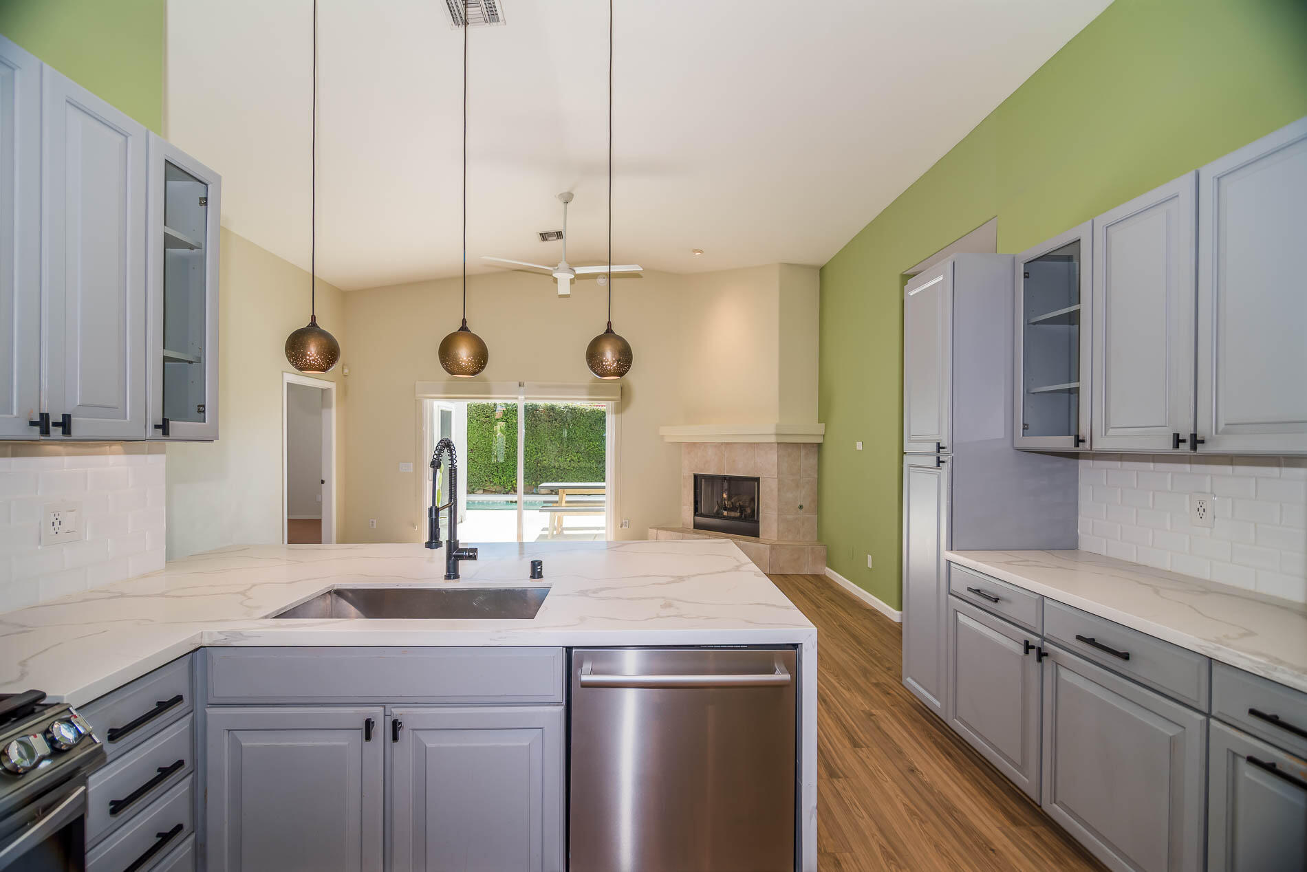 67685 Garbino Road Cathedral City, CA 92234 - Photo 31 of 45 a kitchen with stainless steel appliances a sink a stove and a refrigerator