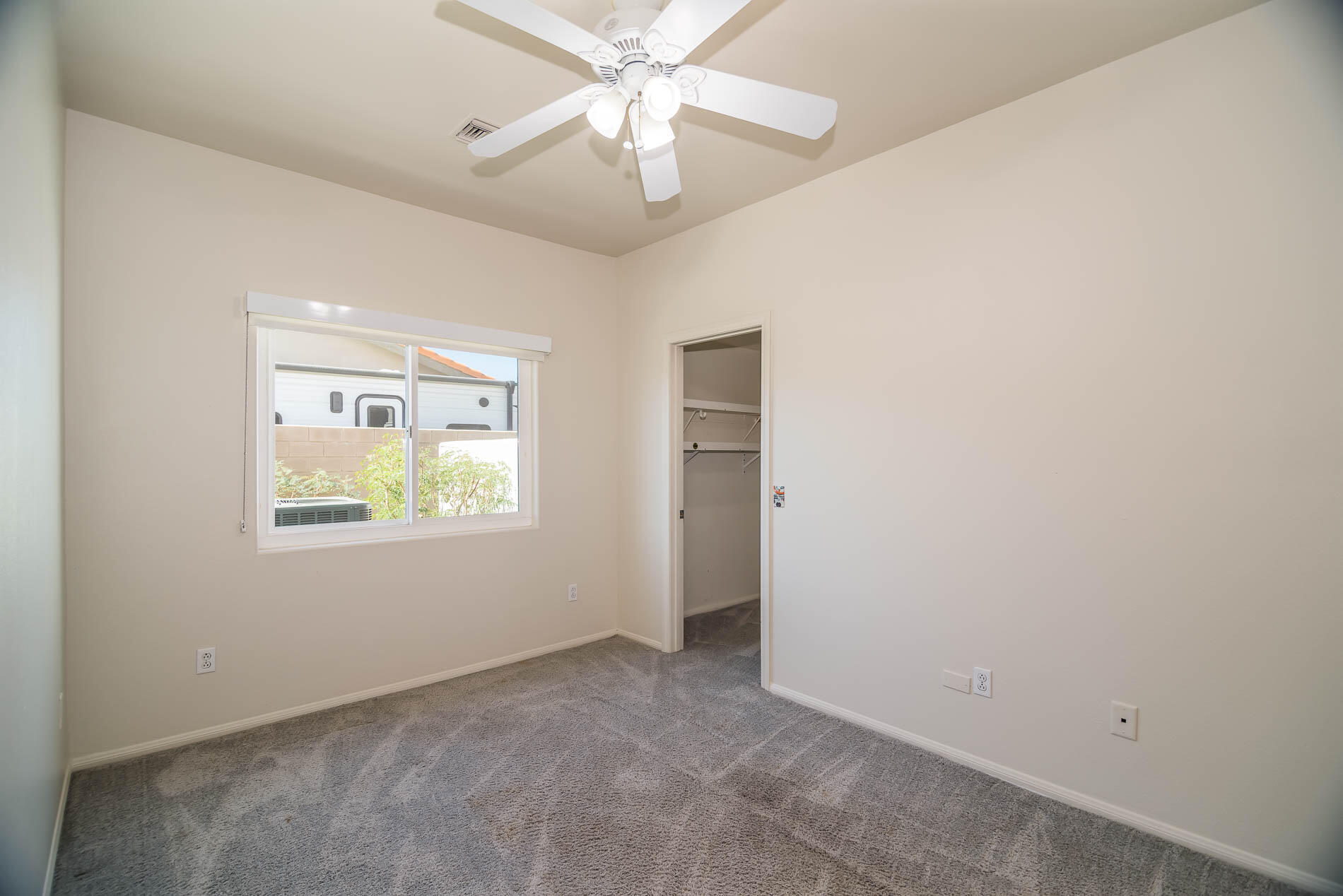 67685 Garbino Road Cathedral City, CA 92234 - Photo 37 of 45 an empty room with windows and fan
