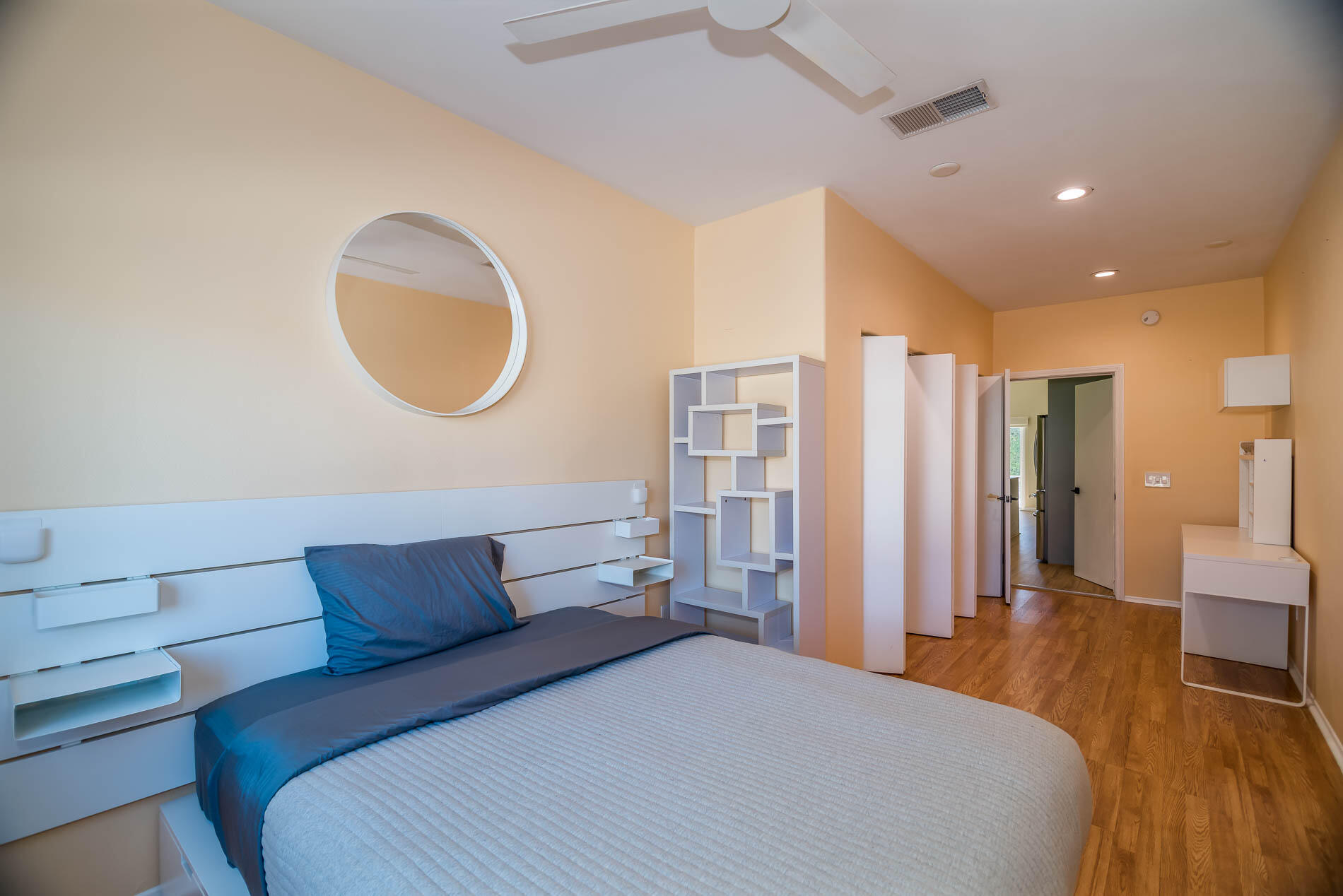 67685 Garbino Road Cathedral City, CA 92234 - Photo 4 of 45 a bedroom with a large bed and a large mirror