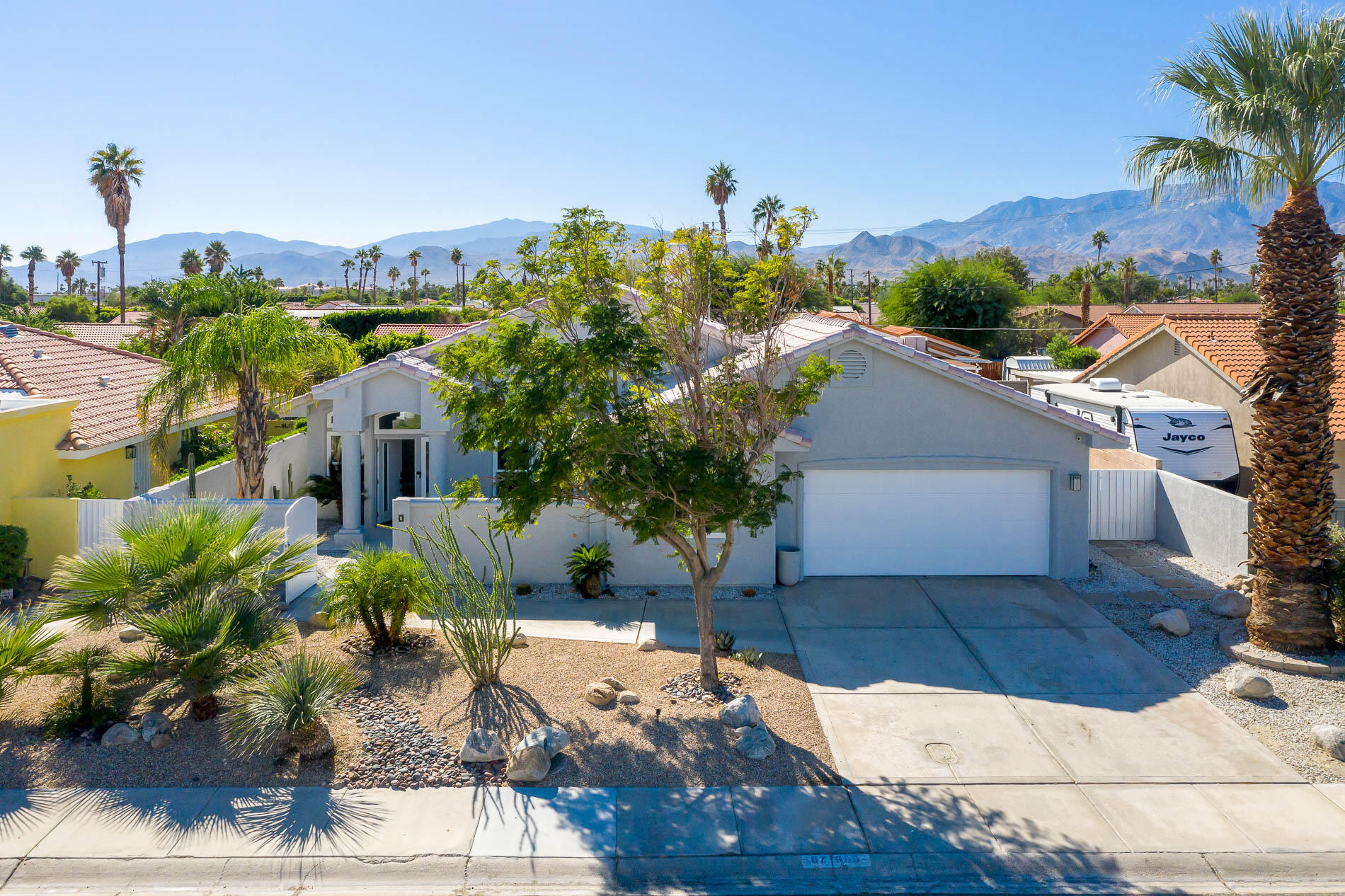 67685 Garbino Road Cathedral City, CA 92234 - Photo 42 of 45 a view of a house with a yard and sitting area