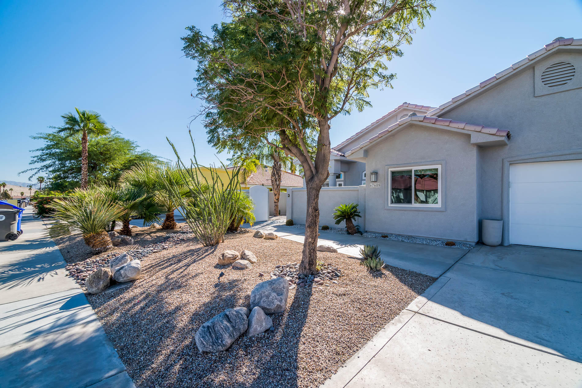 67685 Garbino Road Cathedral City, CA 92234 - Photo 6 of 45 a view of a house with a tree