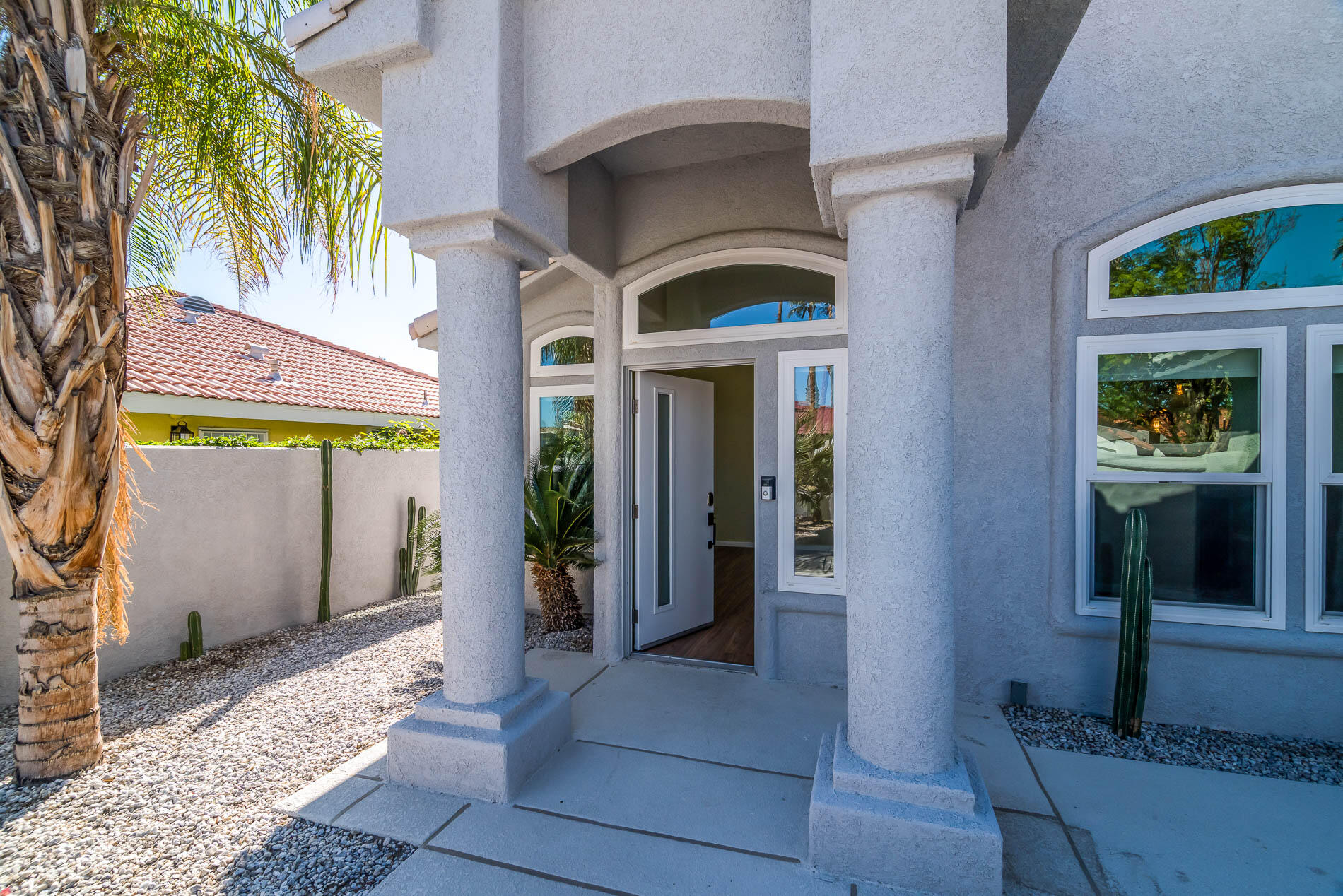 67685 Garbino Road Cathedral City, CA 92234 - Photo 8 of 45 a front view of a building with glass door