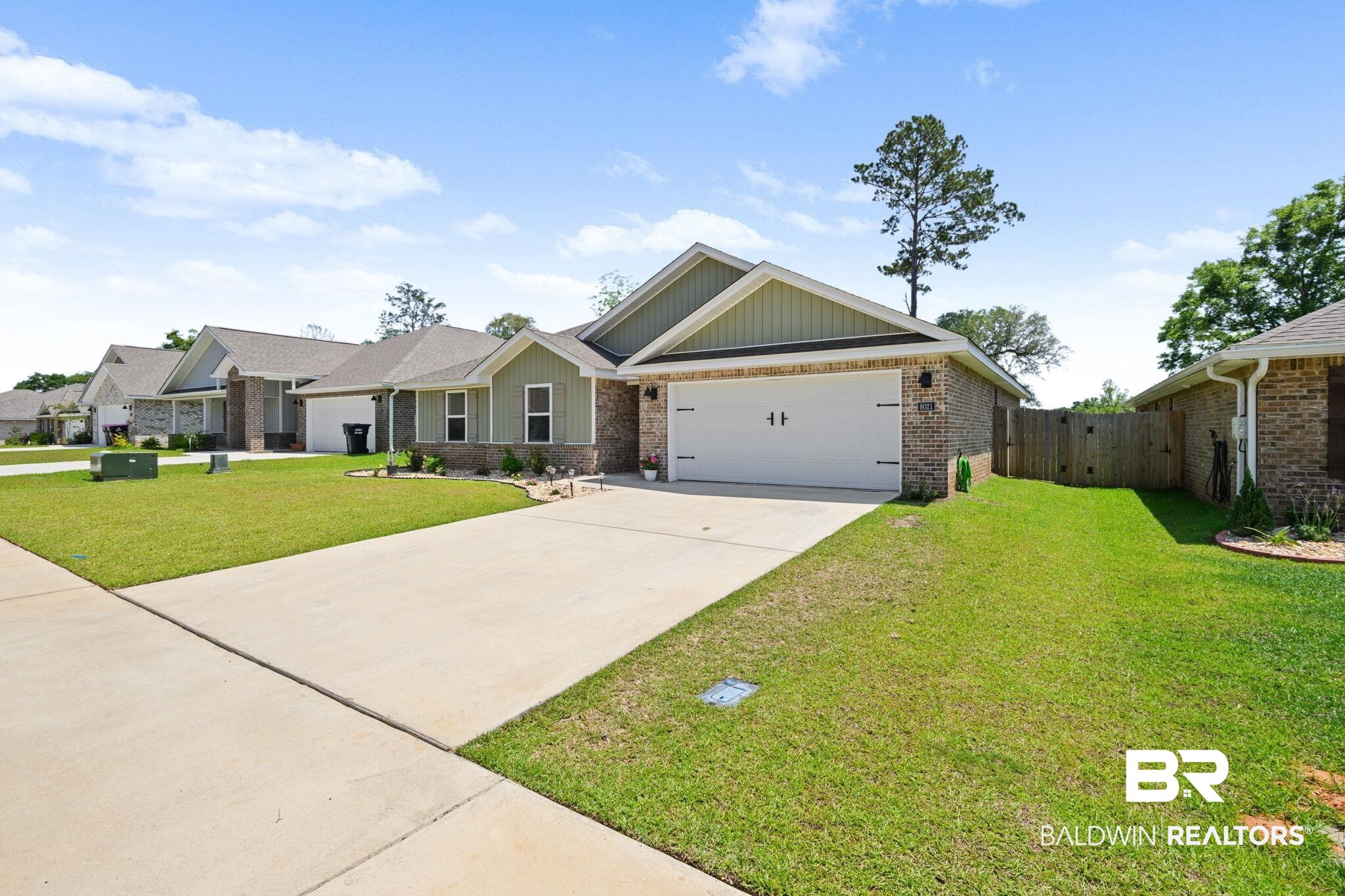 8021 Valor Rdg Way North Mobile, AL 36619 - Photo 3 of 34 Contemporary single-story residence with a brick and siding exterior