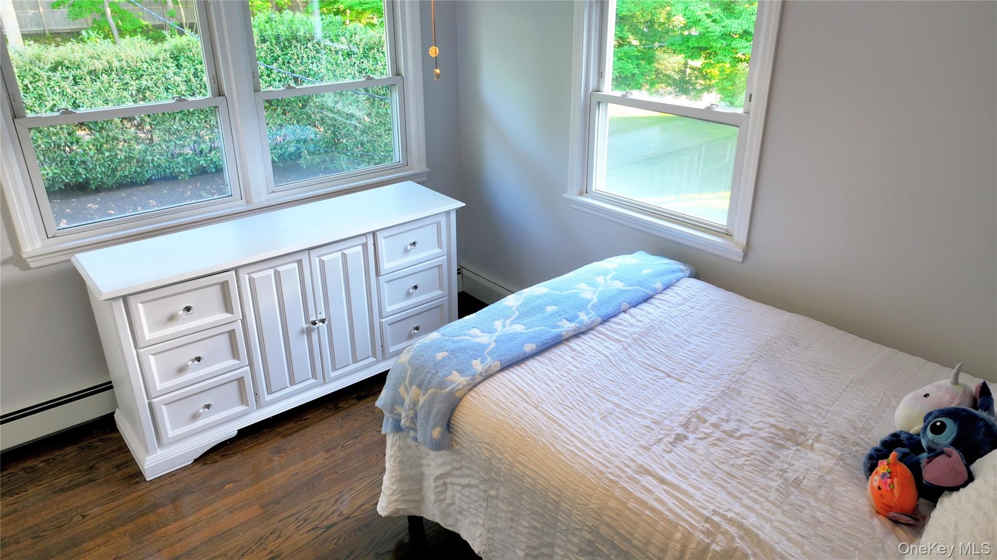 522 Moriches Road St. James, NY 11780 - Photo 29 of 49 a bedroom with a bed and a window
