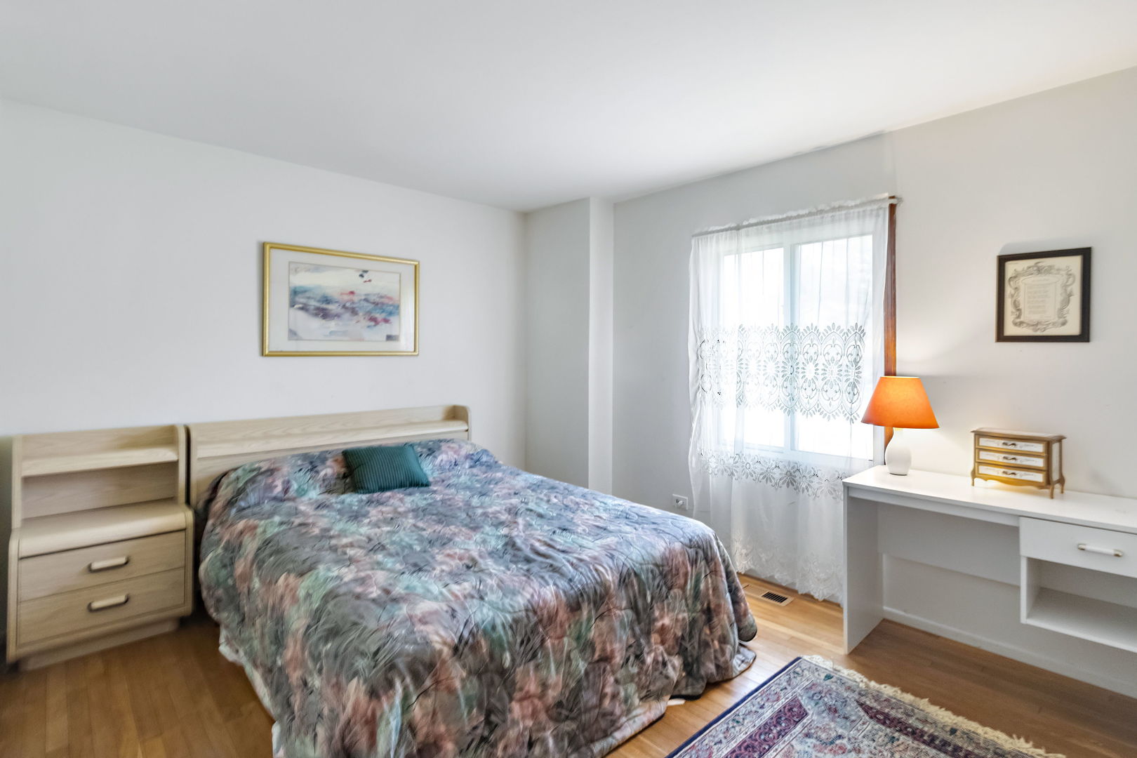 586 Raupp Boulevard Buffalo Grove, IL 60089 - Photo 14 of 26 a bedroom with a bed and a window