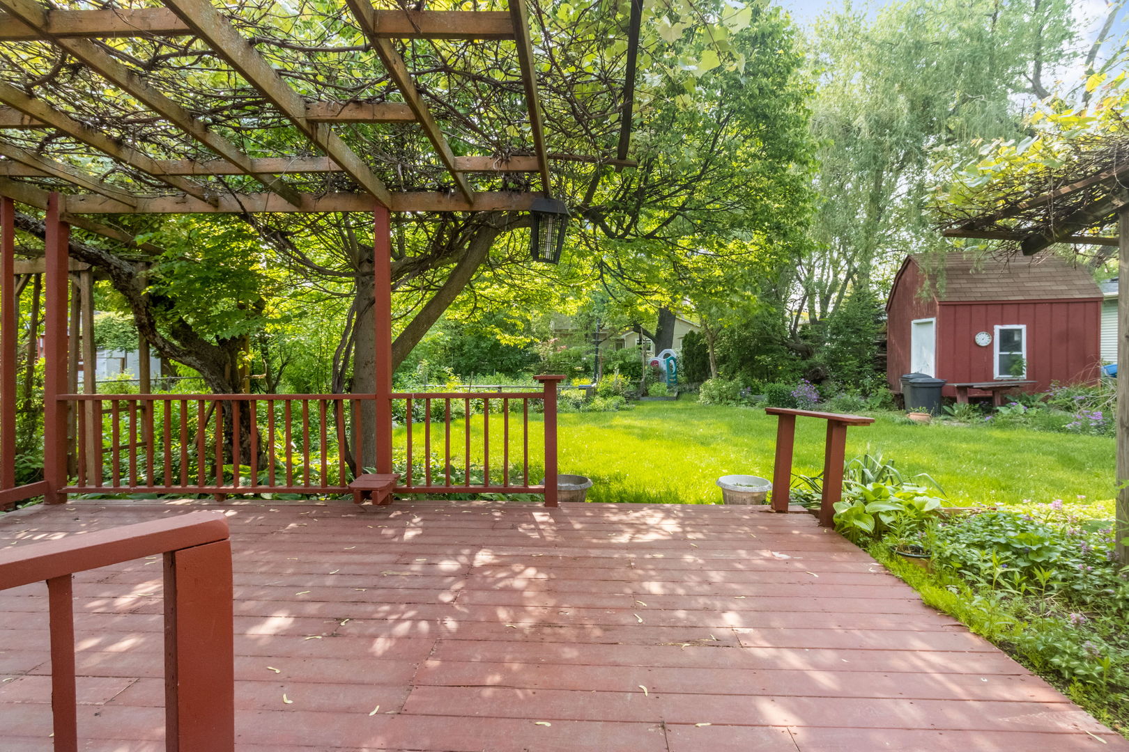 586 Raupp Boulevard Buffalo Grove, IL 60089 - Photo 26 of 26 a view of a swimming pool with a yard and large trees