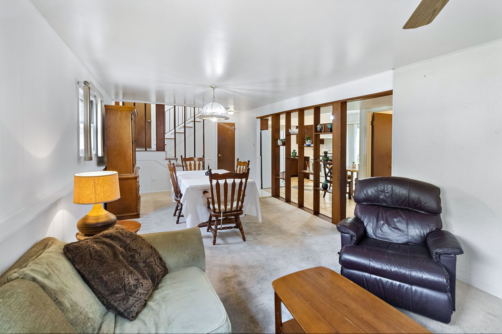 586 Raupp Boulevard Buffalo Grove, IL 60089 - Photo 4 of 26 a living room with furniture and large windows