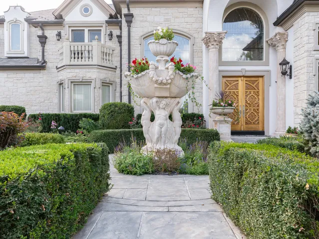 a view of a hallway with dining area and chandelier