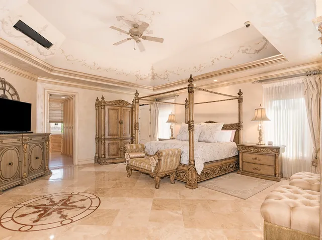 a living room with a bed and furniture