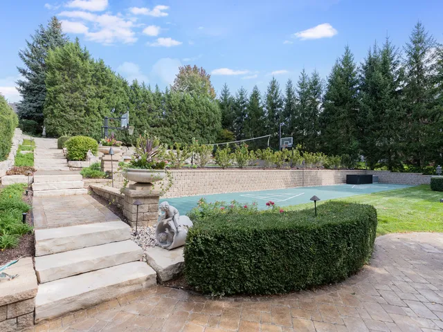 a view of a backyard with swimming pool