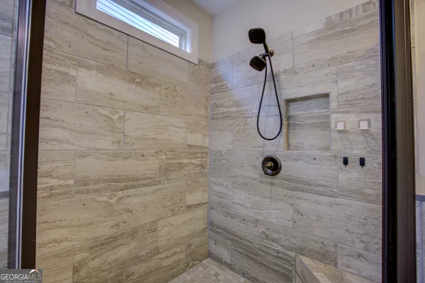 an empty room with a bathroom and sink