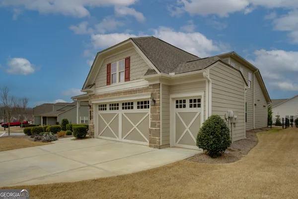 a front view of a house with swimming pool