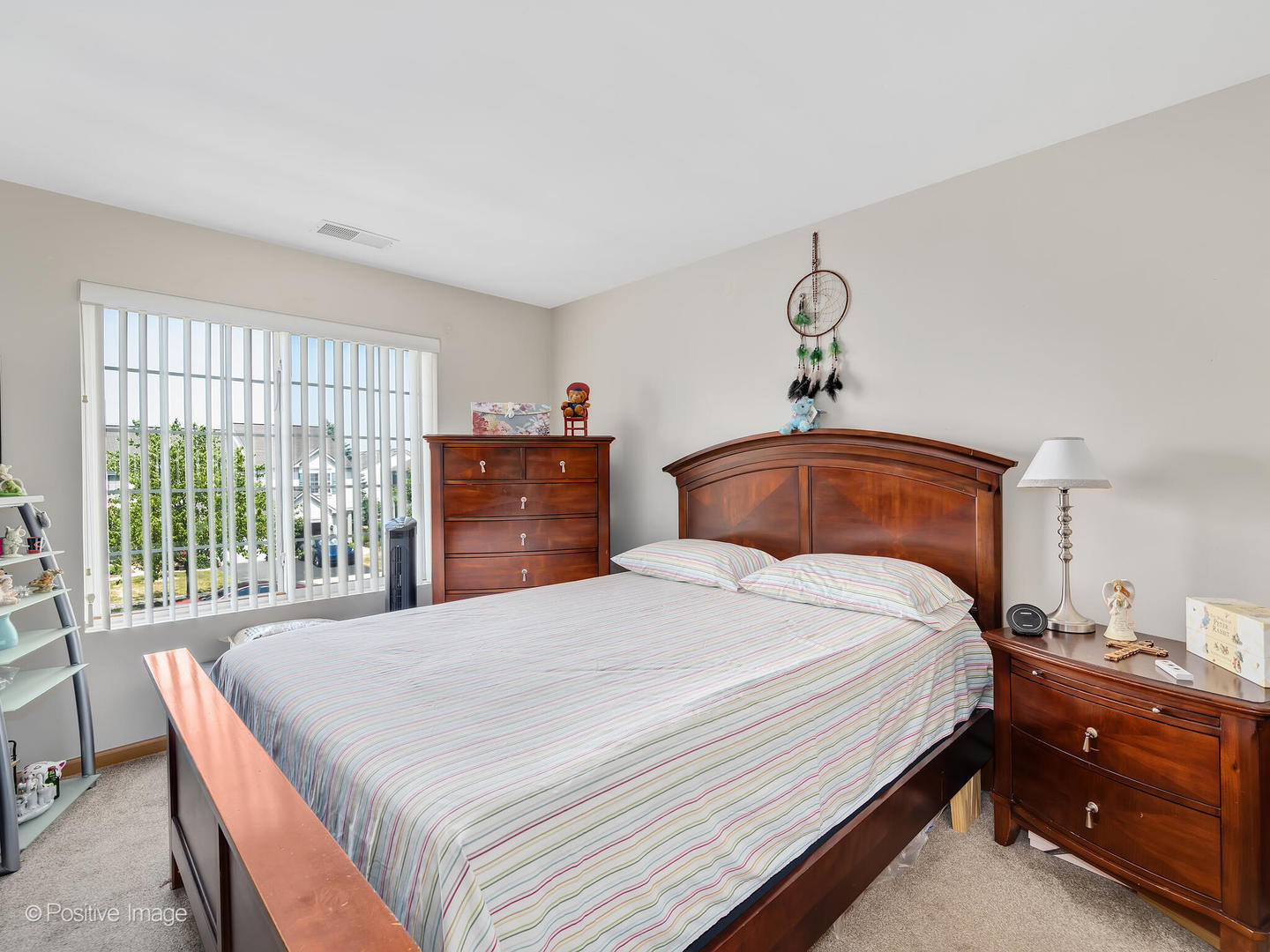 2538 Carrolwood Road Naperville, IL 60540 - Photo 12 of 16 a bedroom with a bed and wooden floor