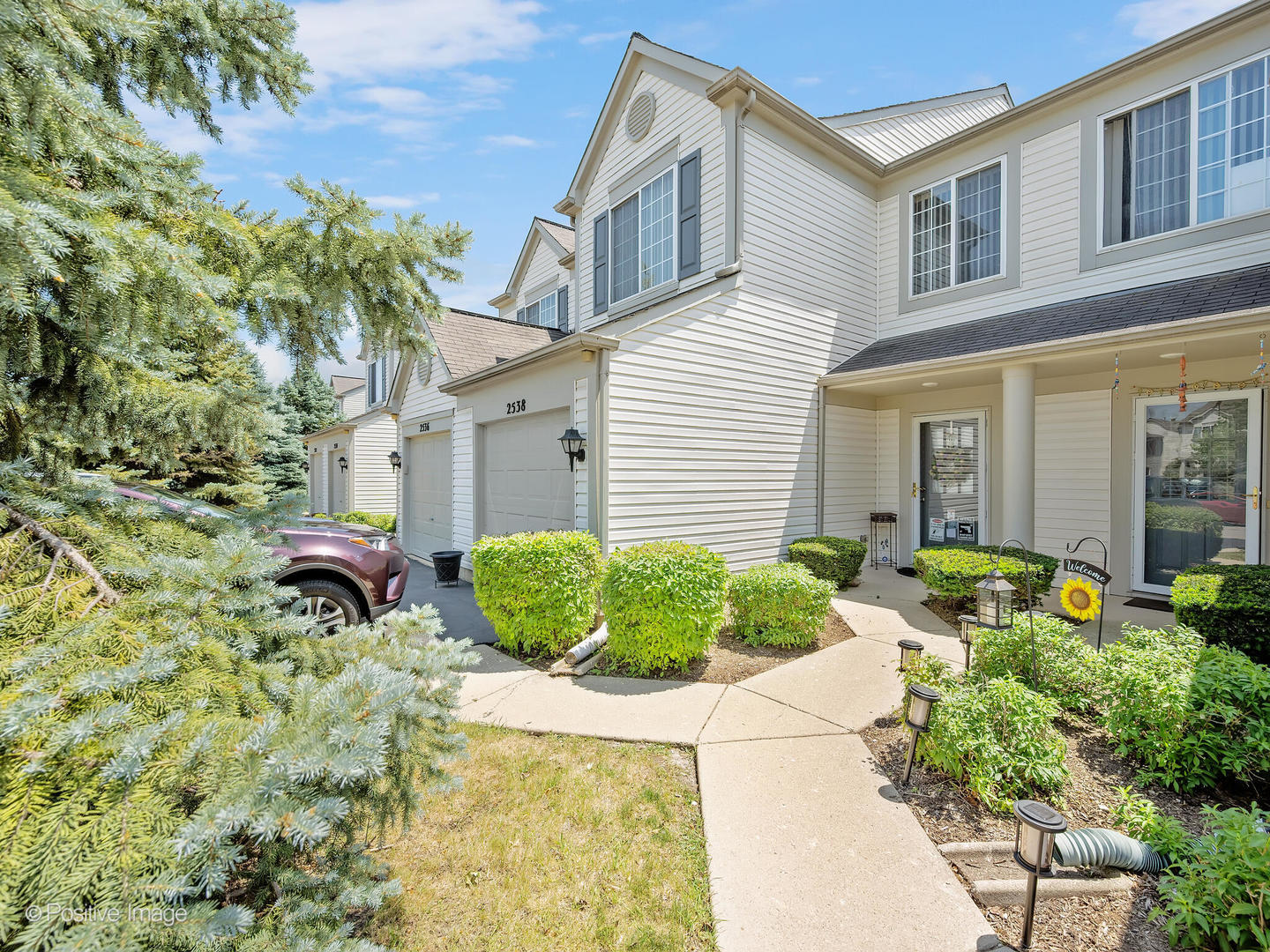 2538 Carrolwood Road Naperville, IL 60540 - Photo 2 of 16 a front view of a house with garden