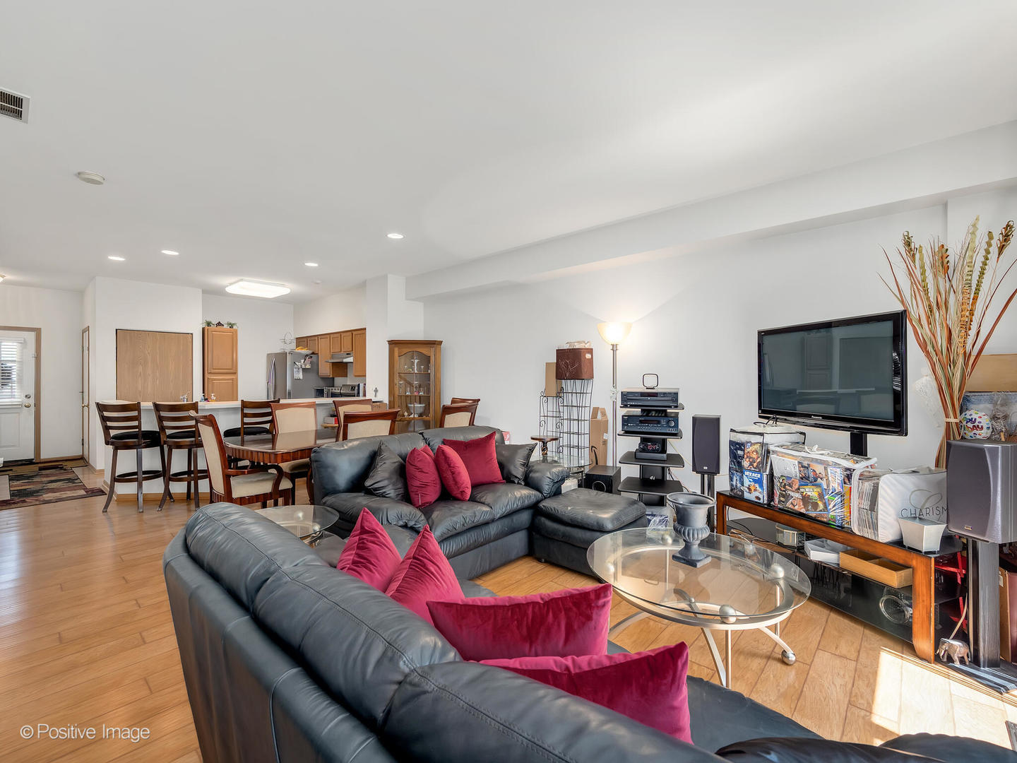 2538 Carrolwood Road Naperville, IL 60540 - Photo 4 of 16 a living room with furniture and a flat screen tv