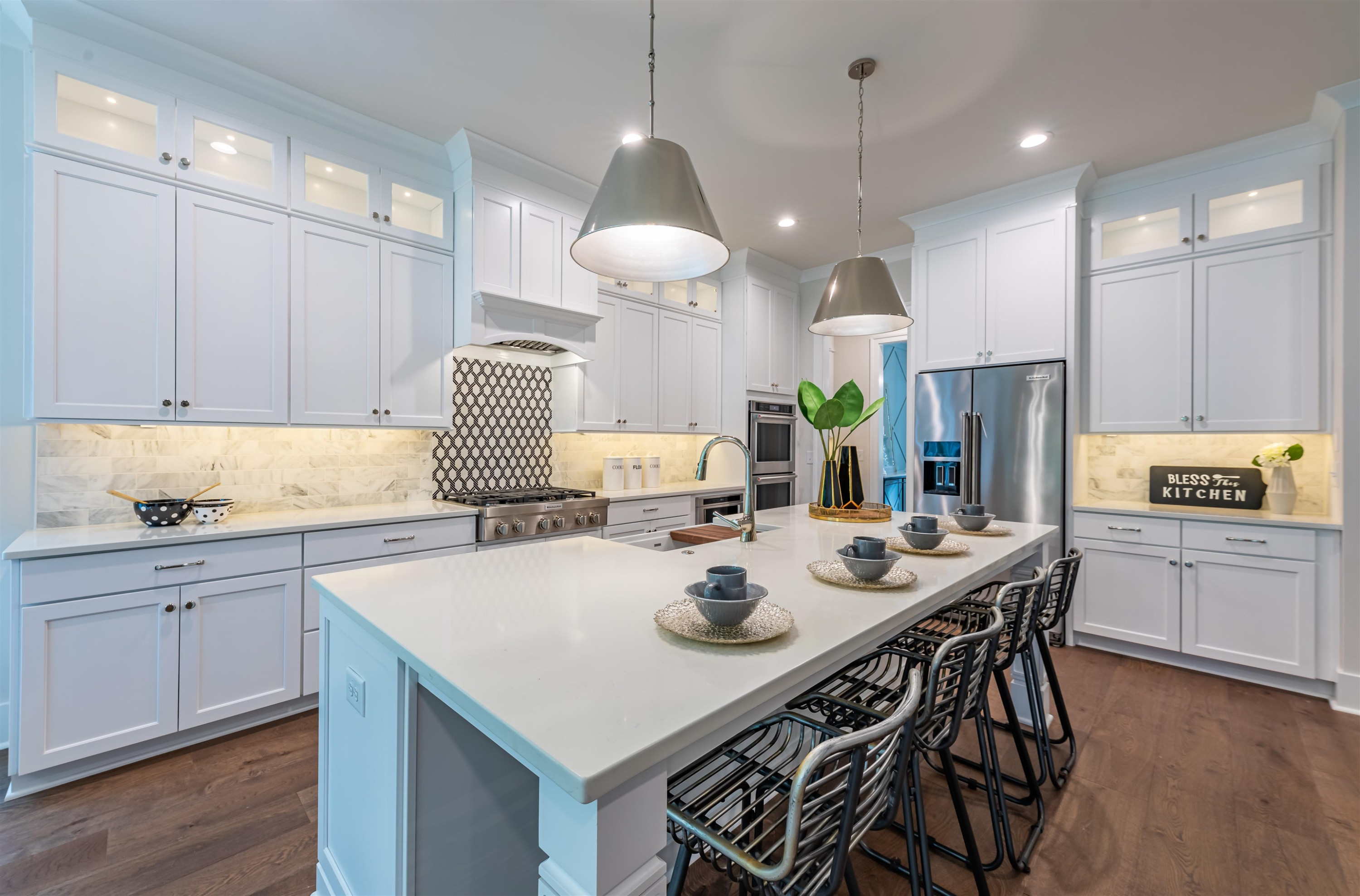 1220 Dixie Trail Raleigh, NC 27607 - Photo 13 of 40 a kitchen with stainless steel appliances kitchen island granite countertop a sink a stove a dining table and chairs
